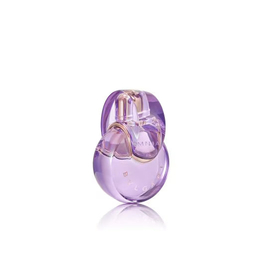 Purple omnia amethyste perfume bottle with gold accents on a white background