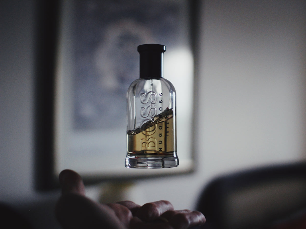 Shallow focus photography of floating perfume bottle