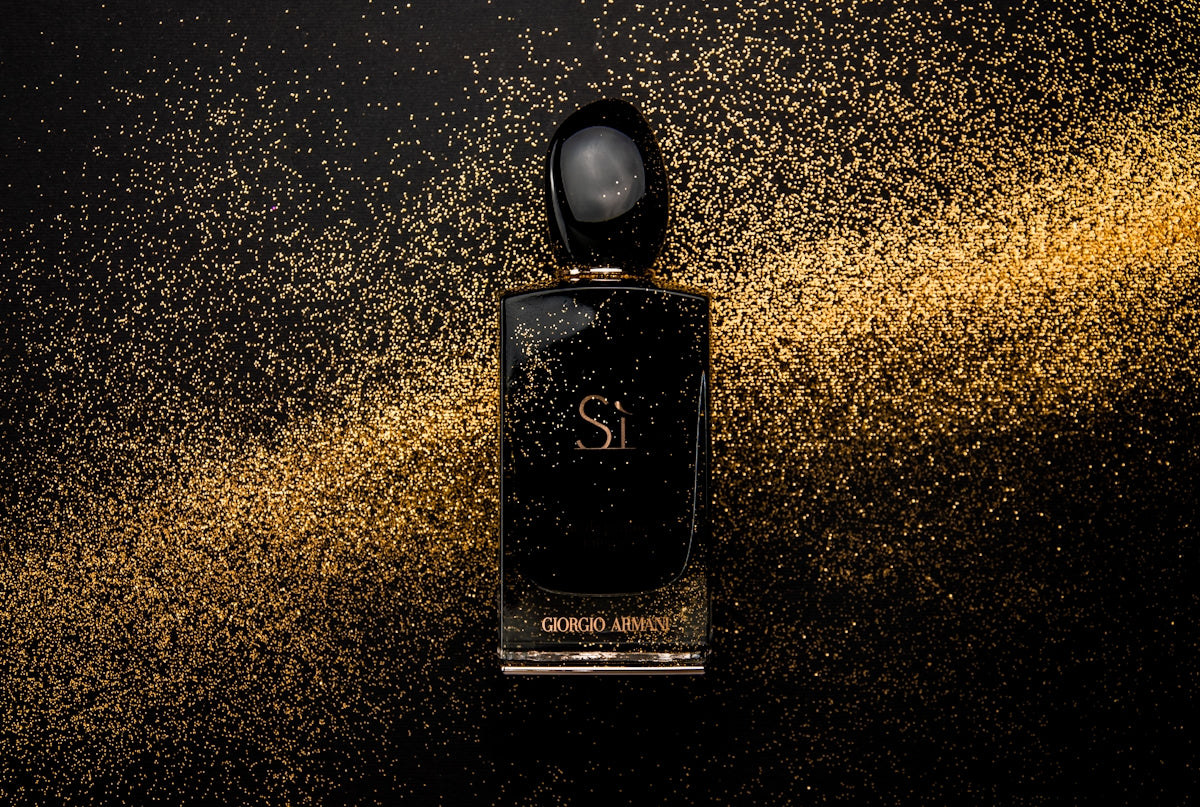 Black glass perfume bottle showing front label