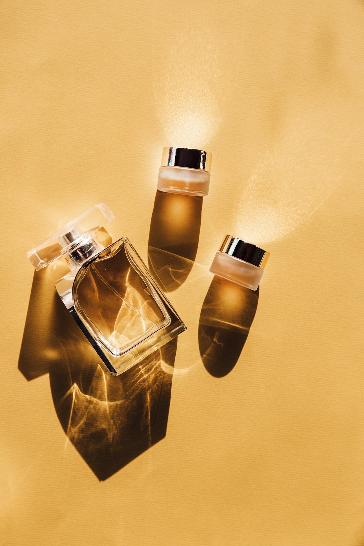 Two clear glass perfume bottles