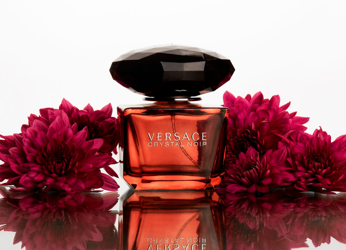 A bottle of perfume sitting on top of a table