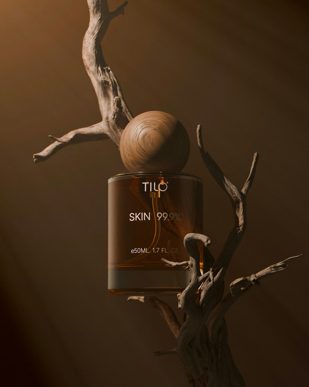A bottle of tic skin 99 on a tree branch